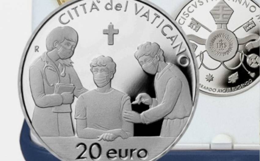 Din scaunul cu rotile, Papa Francisc emite o monedă pro-Vaccinare sub semnul Crucii